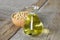 Soybean oil in glass jar and soybean on the woonden background