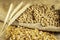 Soybean, wheat and corn seeds on jute background