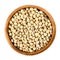 Soybeans in wooden bowl on white background