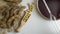 Soybeans in a wooden spoon, pods and soy sauce in a bowl on a white surface. Measuring instrument in a bowl. Top View.