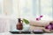 Spa accessories still life with aromatic candle, orchid flower,