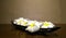 Spa and Aromatherapy Concept, Group of Frangipani Flowers in Black Plate, Still Life