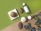 Spa aromatherapy flat lay with bath bombs, cosmetic bottles and mineral stones. Trendy  green and beige background.
