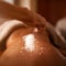 Spa, back and hands with salt massage of a woman with beauty specialist with treatment. Exfoliate, female person