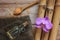 Spa background with bamboo, bath salt, massage oil, orchid flower and towel