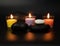 Spa background, candles are burning, black stones on a dark background, large background