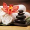 Spa background. White towels on exotic plant, beautiful orchid