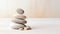 Spa, balance, meditation and zen minimal modern concept. Stack of stone pebbles against beige wall for design and presentation