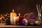 Spa, beauty treatment and wellness background with massage stone, orchid flowers, towels and burning candles