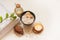 Spa, beauty and wellness background. Towel, cosmetic massage oil, leaf, sea salt with shells and candle