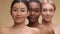 Spa and body care concept. Beauty portrait of three diverse beautiful ladies smiling to camera, standing one by one