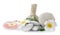 Spa composition with herbal bags and stones on white background