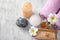 Spa composition with rolled towels, candles and sea salt on wooden background