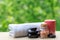 Spa composition on wooden table with zen stones, bottle of salt, candle and towel