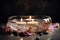 Spa concept. Bowl of water, floating flower petals, lit candles and stones