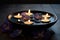 Spa concept. Bowl of water, floating flower petals, lit candles and stones