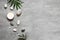 Spa concept on stone background, palm leaves, candle and zen, grey stones, top view