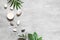 Spa concept on stone background, palm leaves, candle and zen, grey stones, top view