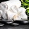 Spa concept of white hibiscus flower, bamboo and towels on zen b