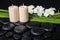 Spa concept of zen basalt stones, three white flower frangipani