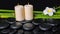 Spa concept of zen basalt stones, white flower plumeria, candles