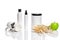 Spa cosmetics, jar of cream, oil with wheat, white cosmetic bottles with apple and wheat towel, candle, soap isolated on