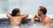 Spa couple happy in wellness hot tub jacuzzi