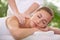 Spa, face and woman or hands with massage for relax, luxury treatment and satisfaction with towel. Person, calm and