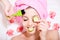 Spa fun: closeup image of funny girl beautiful blond young woman having multi treatment procedures happy smiling eyes closed