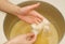 spa hand treatment and beauty,Hand in paraffin bath ,woman receiving heat therapy on hands