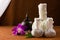 Spa herbal compressing ball with wooden casket and orchid.