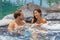 Spa jacuzzi hot tub pool couple happy relaxing on resort holiday hotel honeymoon wellness retreat. luxury vacation on tropical