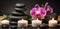 Spa Massage basalt stones with candles, lotus flowers, orchid flower and towels on bamboo mat. Generative AI