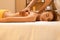 Spa Massage. Beautiful Blonde Gets Spa Treatment in Salon.