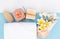 Spa massage, exotic tropical plumeria flowers ,coconut soap,scrub,sea shells, white towels and Himalayan salt  on blue background,