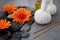 Spa massage setting with rolled towel, thai herbal compress balls and flowers