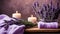 Spa resort concept - Close up of lilac with towels, candles and stones