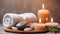 Spa resort concept - Close up of rosemary with towels, candles and stones