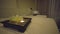 Spa salon room. View of the massage couch. A scented candle is burning. There`s no one in the room, nobody