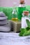 Spa set: massage stones, aromatic oil, sea salt, green gel, organic soap and green towel