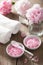 Spa set with peony flowers and pink herbal salt