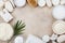 Spa setting from body care, wellness and beauty treatment. Coconut scrub, oil and cream on stone table top view. Flat lay style.