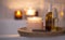 Spa setting with candle, body oil, bath home spa