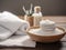 spa setting with a stack of white towels and a small dish of salt