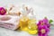Spa skincare setting with oils and natural soap, rosehip oils and flowers