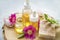 Spa skincare setting with oils and natural soap, rosehip oils and flowers, natural spa still life