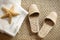 Spa slippers on seagrass carpet with towels