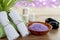 SPA still life with aromatic burning candles, stones, towel and lavender bath salt