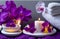 spa still life with candles and orchid beauty treatment items for spa procedures massage, essential towels and sea salt