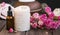 Spa still life with roses, candle and oil bottle.Wellness setting spa